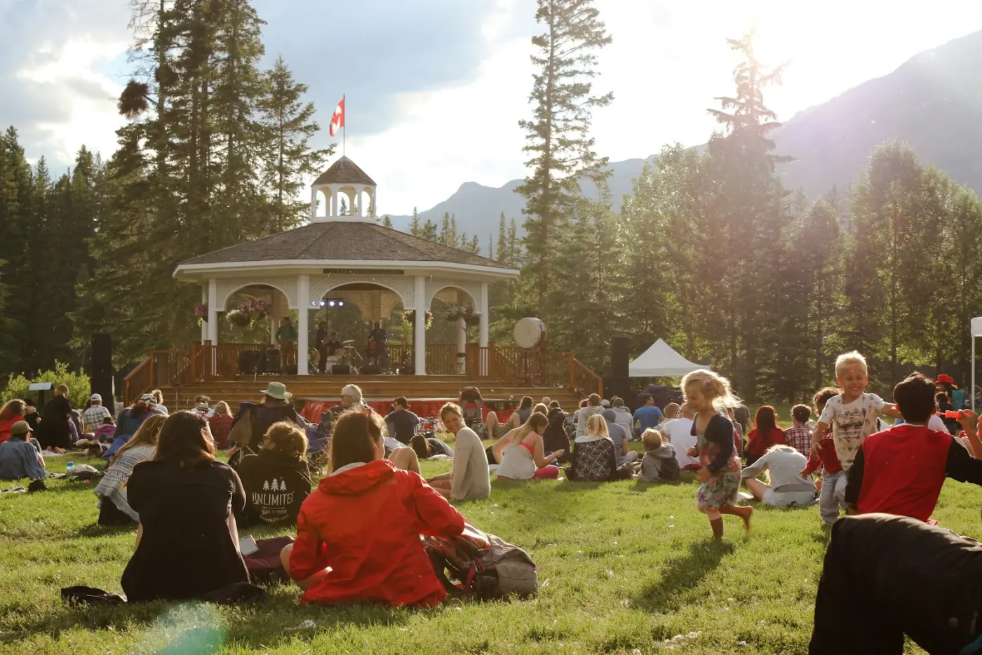 Friends relaxing together on the grass at a summer gathering